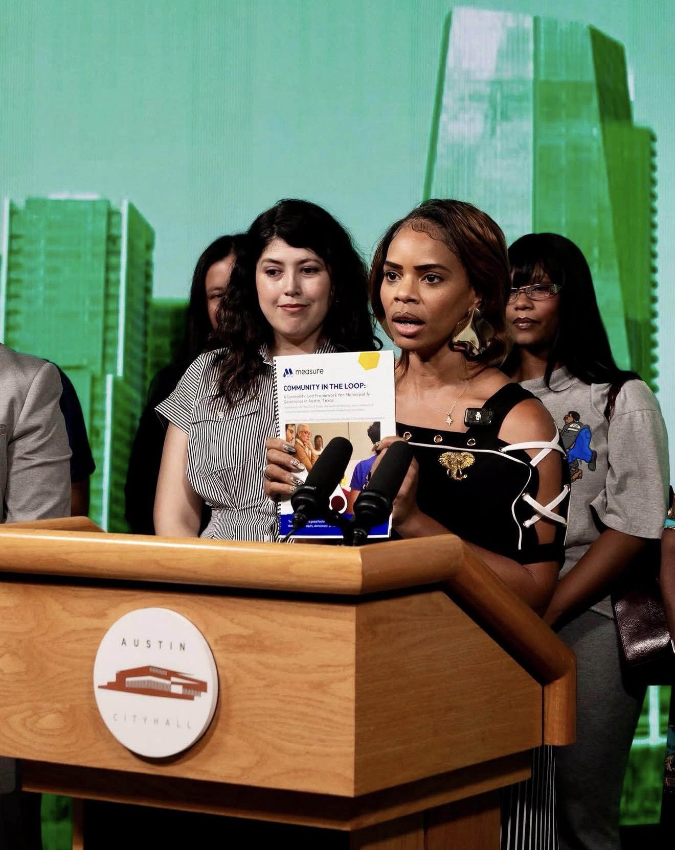 President Meme Styles presenting the final Communities In The Loop AI Governance Model at Austin City Hall