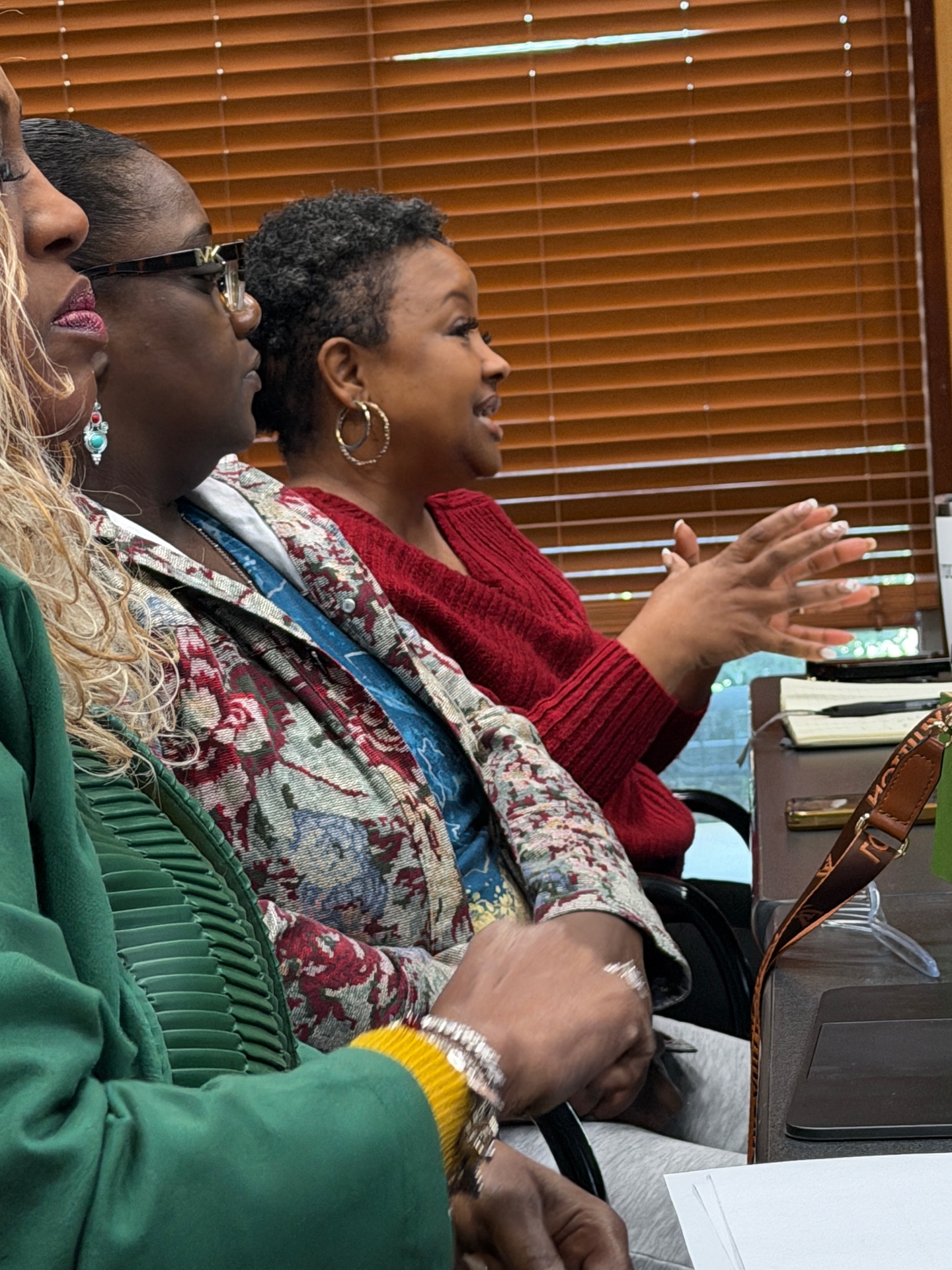 Community members in close conversation during a Measure listening session